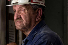 Superintendent David Gayhart, 61, of Dorton, Ky., patiently watches for the inspector and for his remaining miners to come out from underground at the office of Cheyenne Mining in Tram, Floyd County, Kentucky, on August 7, 2018. Gayhart has been a miner for roughly 41 years. ©2017 Brittany Greeson/Kentucky Documentary Photographic Project