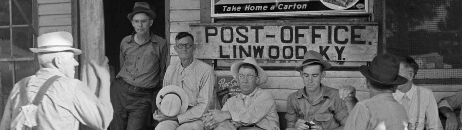 marion-post-wolcott-front-of-the-post-office-1600×450
